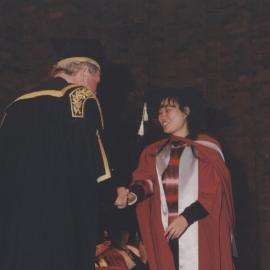 Chancellor Ric Charlton congratulates a graduate at the Faculty of Science / Maths graduation ceremony, the University of Newcastle, Australia - 9 May 1997, 6pm