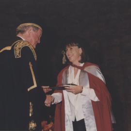 Chancellor Ric Charlton congratulates a graduate at the Faculty of Science / Maths graduation ceremony, the University of Newcastle, Australia - 9 May 1997, 6pm