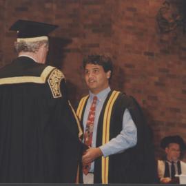 A graduating student prepares to receive his testamur, 8 May 1997, 10.30pm, the University of Newcastle, Australia