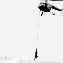 A man being rescued during the 1955 Maitland Flood: Lucey Collection