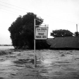 Sim Bros private parking area under flood waters during the Maitland Flood, 1955: Lucey Collection