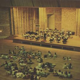 Orchestra performing in front of a group of students at the Great Hall, the University of Newcastle, Australia