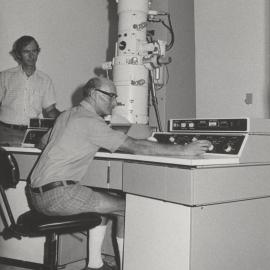 Two gentlemen pictured using high tech microscopic equipment, the University of Newcastle, Australia