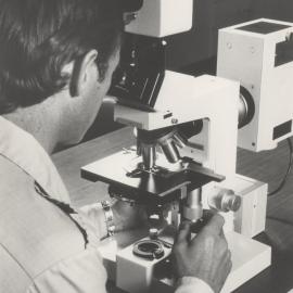 Scientist using microscope, the University of Newcastle, Australia