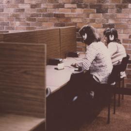 Library users using audio visual equipment, Auchmuty Library, University of Newcastle, Australia