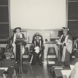 Hon. C.B. Cutler receiving Honorary Degree, showing Professors Auchmuty and J. Allen: University of Newcastle, Australia