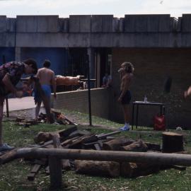 Student Union Opening - Chopping wood for lamb-on-the-spit - Newcastle University, NSW