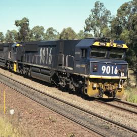 9016 and two other ninety class locos on an empty down coal train at Camberwell Junction, NSW