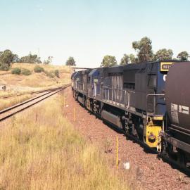Three ninety class locos with 91 loaded bat wings at Camberwell Junction, NSW