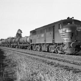 4489 on a short down goods with milk tankers and oil tankers at Antiene, NSW