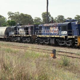 Two 48 class locos with a grain hopper in the silo sidings at Werris Creek, November 2012.