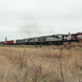 4814 and three EL class locos on an up container train south of Moree, July 1999.