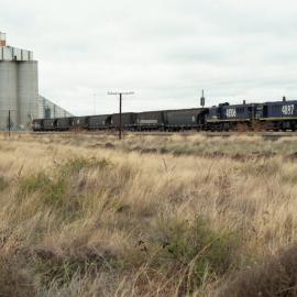 4897 and 48106 shunt a grain train south of Moree, July 1999.