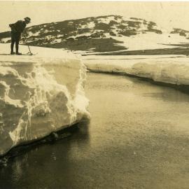 Skier overlooking a river in the Snowy Mountains, NSW, [c. 1910s]