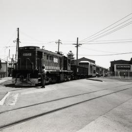 48148 and Victorian Railways MET set, crossing Broadmeadow Rd, 9 December 1991