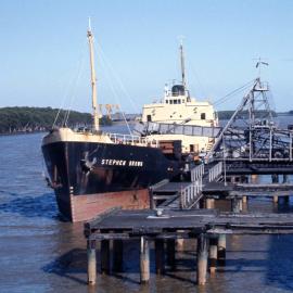 J.& A. Brown Collier, Stephen Brown, moored at coal loading wharf on Hunter River, Hexham, NSW, 11 December 1973