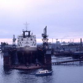 WH Resolution in dry dock at viewed from P & O Arcadia, Hunter River, Newcastle, NSW, 20 October 1975
