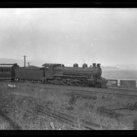 TGR R Class, number not legible, hauling passengers, waterfront line, unidentified location, [n.d.]
