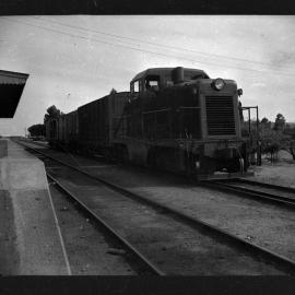 Commonwealth Railways DE Class, no 90, shunting goods vans at Port Augusta, [1950s]