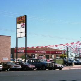 Bi-Lo supermarket and Frens' Holden dealership, Kurri Kurri, December 1989