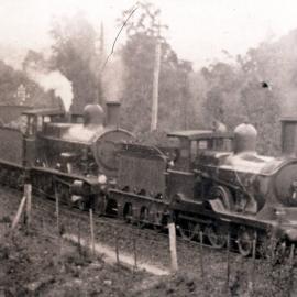 NSWGR D-261 Class 4-4-0 Type assisting a P-6 Class 4-6-0 Type Locomotive hauling an express passenger in the Blue Mountains, [1900]