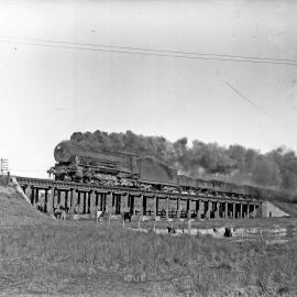 NSWGR D57 Class, No. 5714, 4-8-2 Mountain Type heavy goods locomotive on up coal train at Emu Plains, [1940]