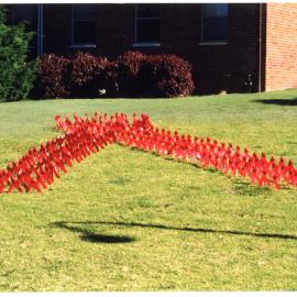 Giant Red Ribbon made by AIDS unit staff outside Byrne House, John Hunter Hospital Campus