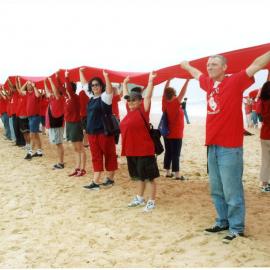 Giant Red Ribbon for World AIDS Day, Kellie Schneider RN, Newcastle Beach, NSW