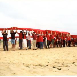 Giant Red Ribbon for World AIDS Day, Newcastle Beach, NSW
