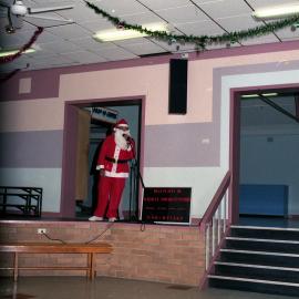 Santa checking the sound system, Christmas Carols at Kurri Kurri, NSW, December 1986