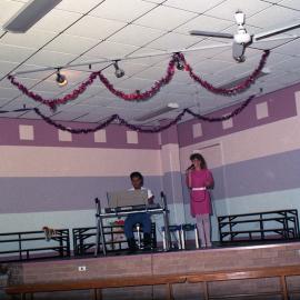 Vicki Radnidge, accompanied by pianist, Christmas Carols at Kurri Kurri, NSW, December 1986