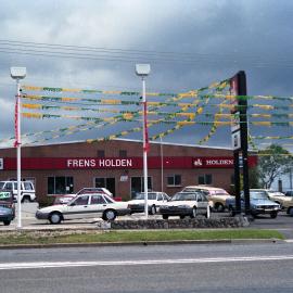 Stormy sky over Fren's Holden car yard, Kurri Kurri, NSW, December 1987
