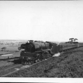 Victorian Railways R Class, no. 732, hauling passenger train, unidentified location, [September 1952] 