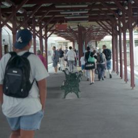 Passengers from a train from Sydney walking along No. 2 platform, Newcastle Station, November 2014