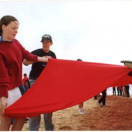 Giant red ribbon for World AIDS Day Newcastle Beach