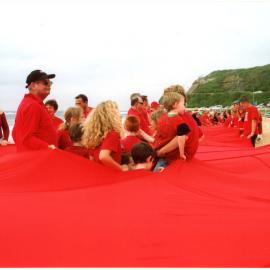 Giant red ribbon for World AIDS Day Newcastle Beach