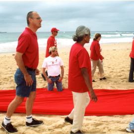 Giant red ribbon for World AIDS Day Newcastle Beach
