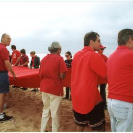 Giant red ribbon for World AIDS Day Newcastle Beach