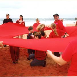 Giant red ribbon for World AIDS Day Newcastle Beach