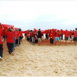 Giant red ribbon for World AIDS Day Newcastle Beach