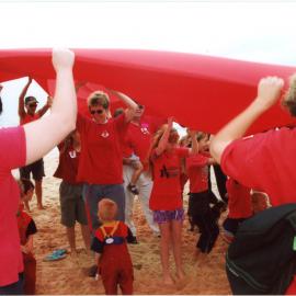 Giant red ribbon for World AIDS Day Newcastle Beach