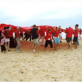 Giant red ribbon for World AIDS Day Newcastle Beach