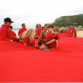 Giant red ribbon for World AIDS Day Newcastle Beach