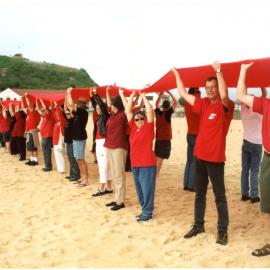Giant red ribbon for World AIDS Day Newcastle Beach