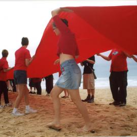 Giant red ribbon for World AIDS Day Newcastle Beach