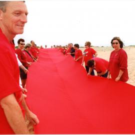 Giant red ribbon for World AIDS Day Newcastle Beach