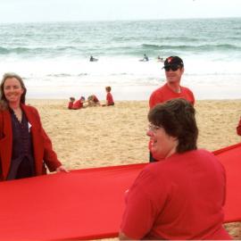 Giant red ribbon for World AIDS Day Newcastle Beach