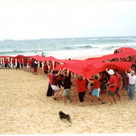 Giant red ribbon for World AIDS Day Newcastle Beach