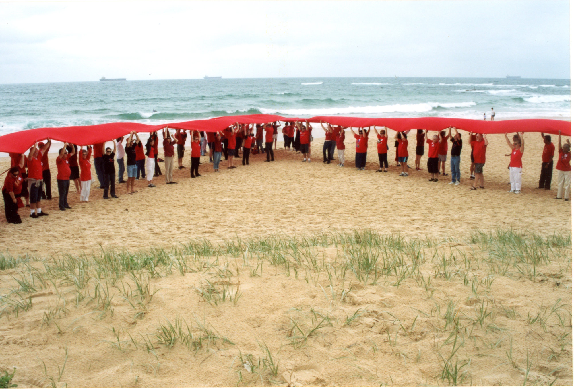 Giant red ribbon for World AIDS Day Newcastle Beach