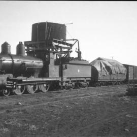 Queensland Railways B15 class, at water tower, unidentified location, rural [n.d.] 2